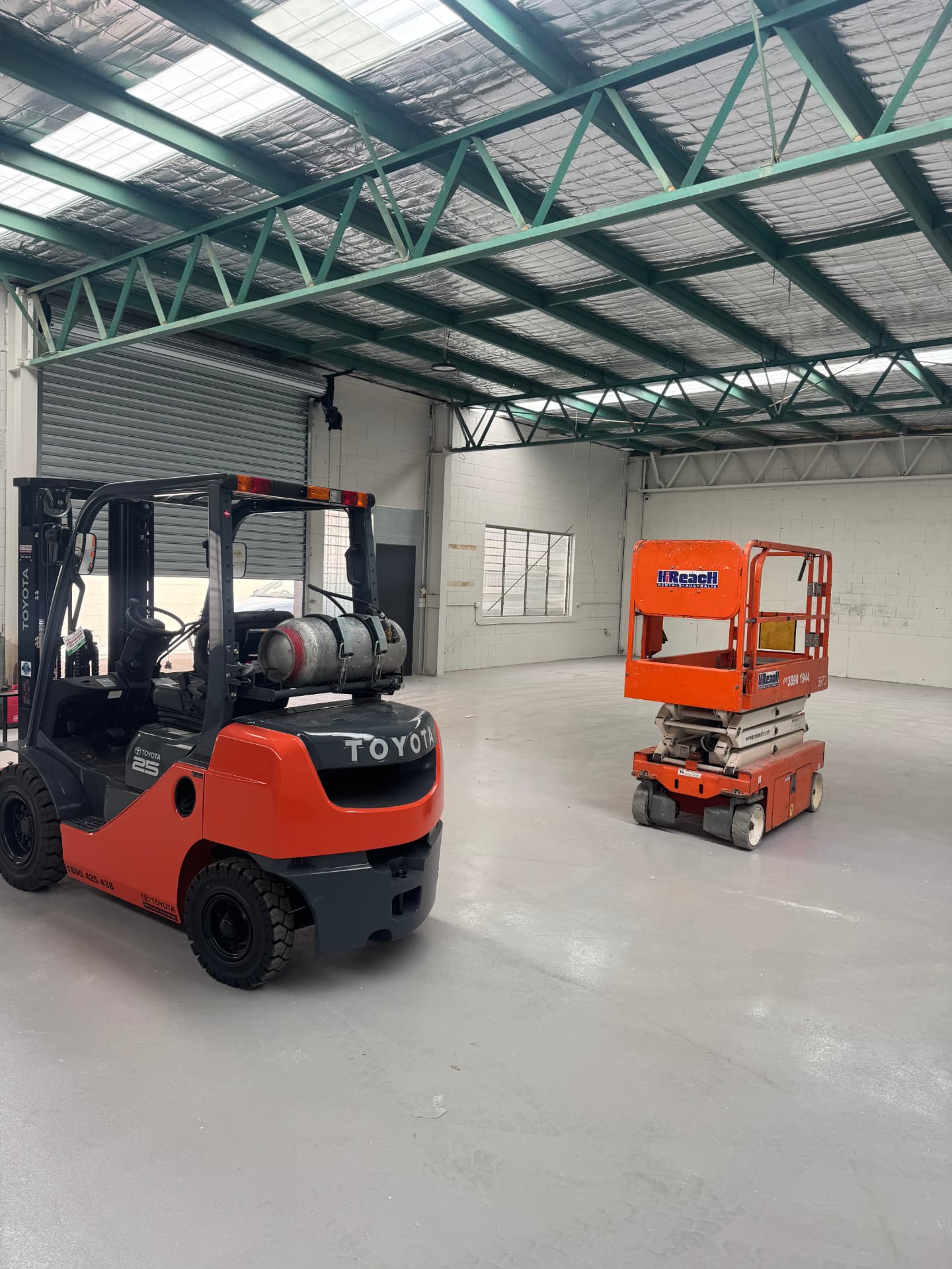 Toyota forklift and scissor lift inside the HD Training warehouse at Underwood